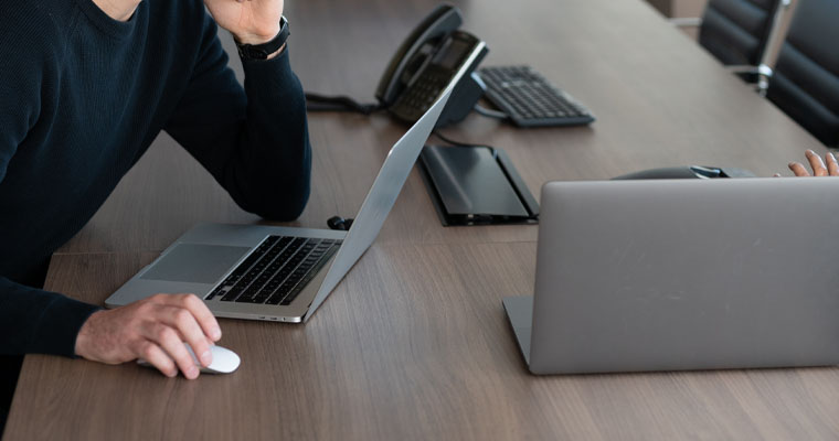 an image showing laptops and other technology equipment on a desk, representing accessibility testing tools.