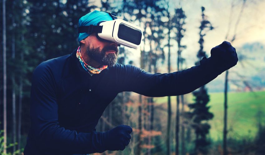 A photo of a man using a virtual reality headset, wearing a specially created virtual simulation suit